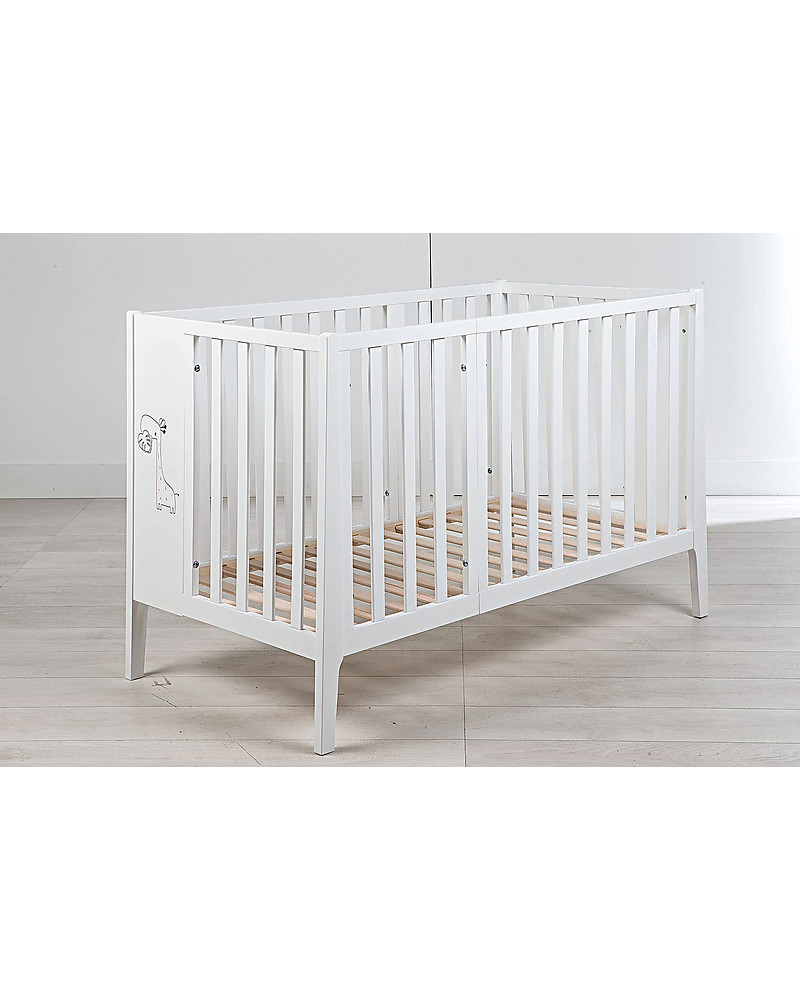 white crib with wood bars
